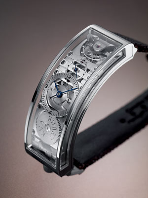 Technische Details: "Ari" misst in der Länge 52 mm und ist 21,6 mm
schmal. Das Gehäuse ist in 18 Karat Gold oder 950er-Platin erhältlich,
Zifferblätter in 18 Karat Gold, drei entspiegelte Saphir-Gläser,
freischwingende Unruh mit Regulierschrauben, Unruhfrequenz 18.000 vph /
2,5 Hz, 40 h Gangreserve, 18 Rubinlager, 209 Einteile Technische Details: "Ari" misst in der Länge 52 mm und ist 21,6 mm
schmal. Das Gehäuse ist in 18 Karat Gold oder 950er-Platin erhältlich,
Zifferblätter in 18 Karat Gold, drei entspiegelte Saphir-Gläser,
freischwingende Unruh mit Regulierschrauben, Unruhfrequenz 18.000 vph /
2,5 Hz, 40 h Gangreserve, 18 Rubinlager, 209 Einteile