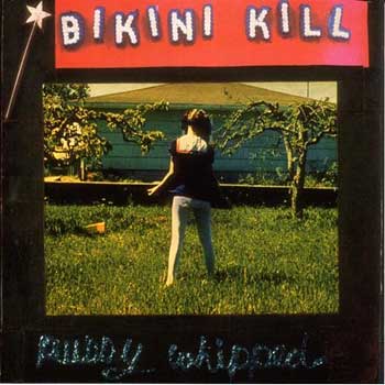 1993 erschien das dritte Album von Bikini Kill "Pussy Whipped" auf dem Label Kill Rock Stars, u.a. mit der Riot Grrrl Hymne "Rebel Girl".
Darin sing Hanna: "When she talks, I hear the revolutionsIn her hips, there's revolutionsWhen she walks, the revolution's comingIn her kiss, I taste the revolution." 1993 erschien das dritte Album von Bikini Kill "Pussy Whipped" auf dem Label Kill Rock Stars, u.a. mit der Riot Grrrl Hymne "Rebel Girl".
Darin sing Hanna: "When she talks, I hear the revolutionsIn her hips, there's revolutionsWhen she walks, the revolution's comingIn her kiss, I taste the revolution."